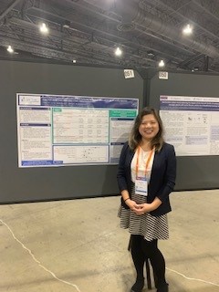 Stephanie Cheng smiling during her poster presentation on the CF registry at the NACFC.