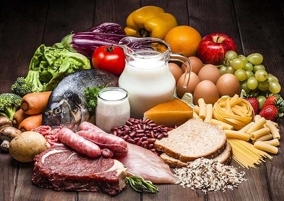 Image of nutrional food with dairy, meats, fish, and fruits
