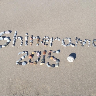 Multicolored stones arranged to spell Shinerama 2015