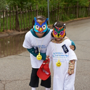 two children wearing masks