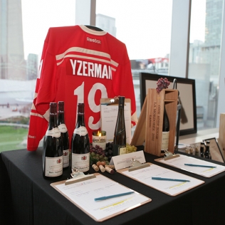 Items for auction: bottles of wine and an Yzerman jersey