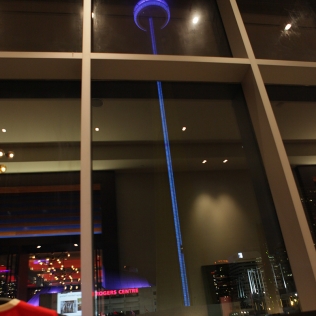 the CN tower lit up blue