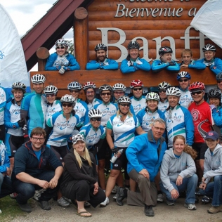 A group photo in front of the Banff sign