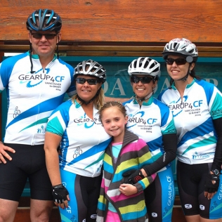 A girl and 4 cyclists