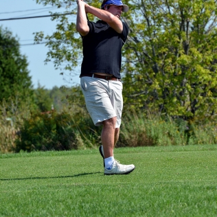 a golfer swinging