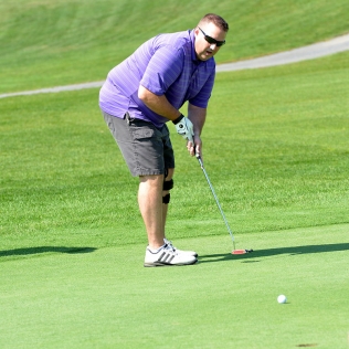 a golfer about to putt