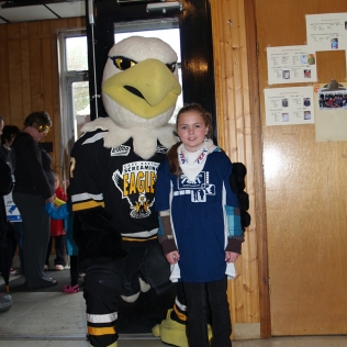 An eagle mascot and a girl